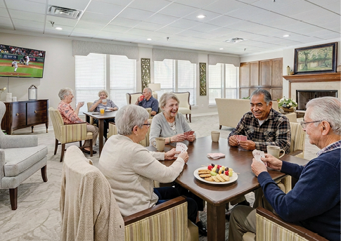 Four men are sitting around a table, playing cards. AI generated content